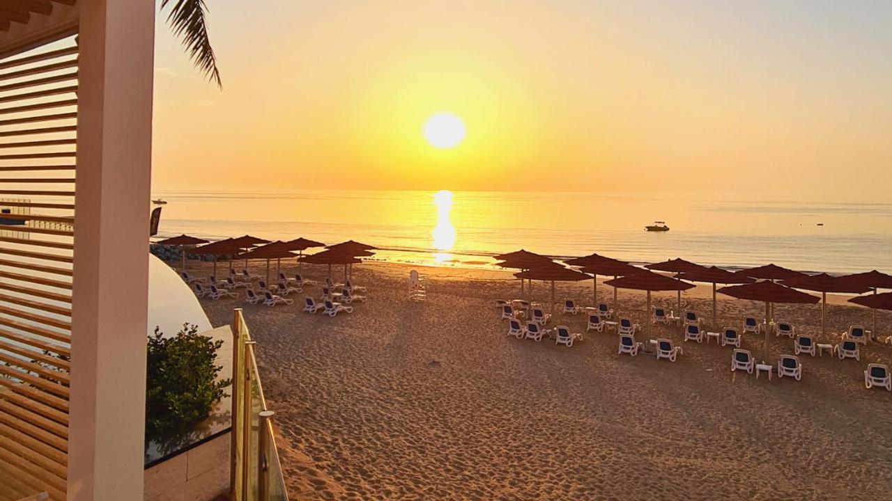 Royal M Al Aqah Beach Resort By Gewan Exterior foto Sunset at the beach