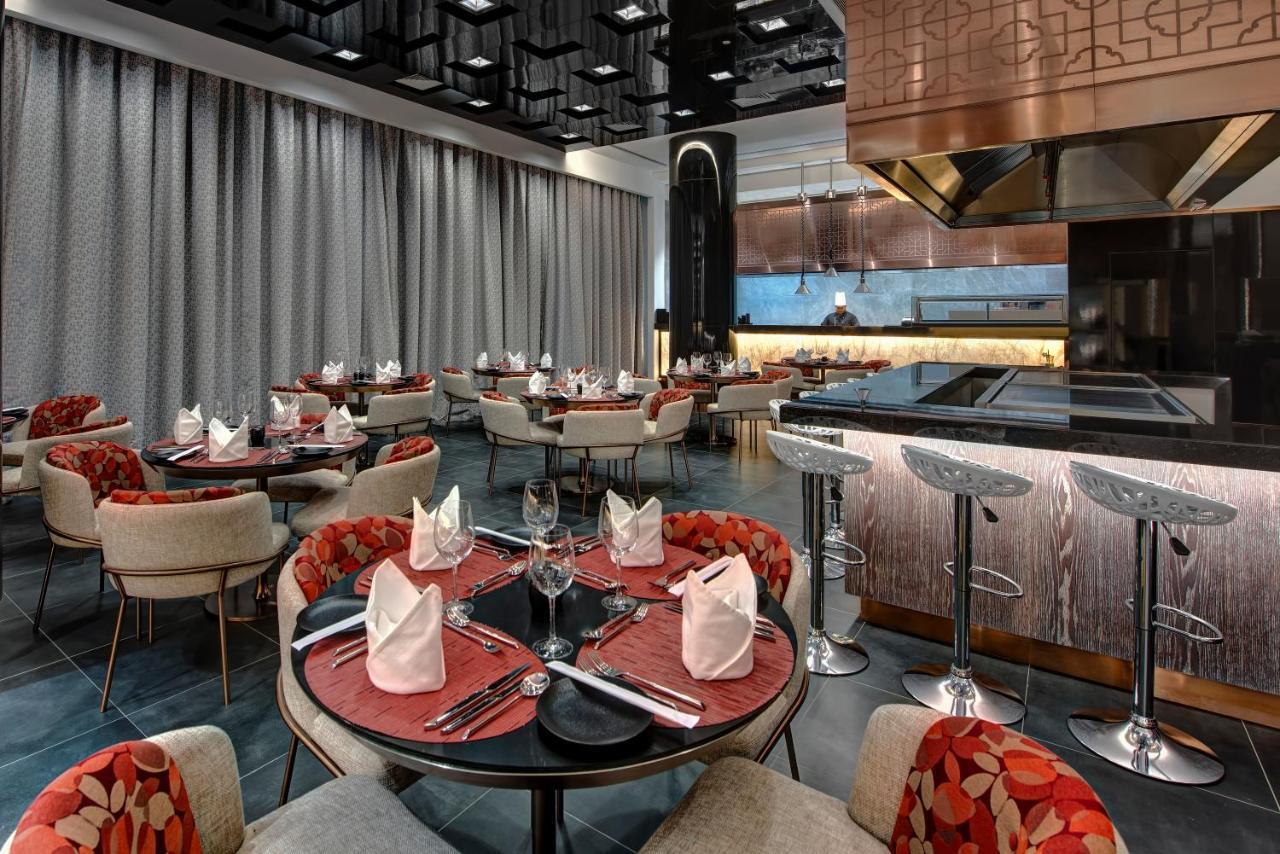 Royal M Al Aqah Beach Resort By Gewan Exterior foto The interior of the restaurant
